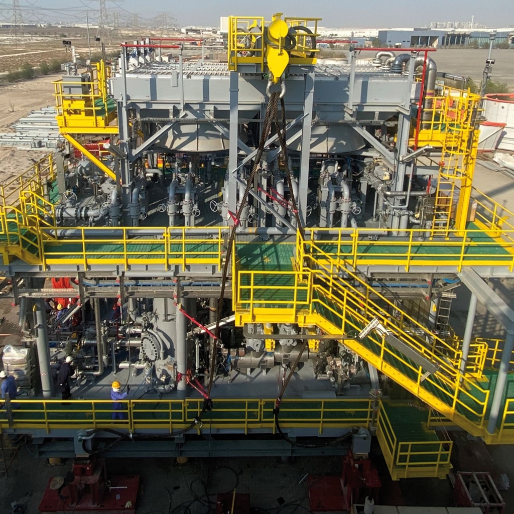 Workers assemble DBB Valves at a gas lift compression module of a floating, production, storage and offloading (FPSO) vessel in West Africa.