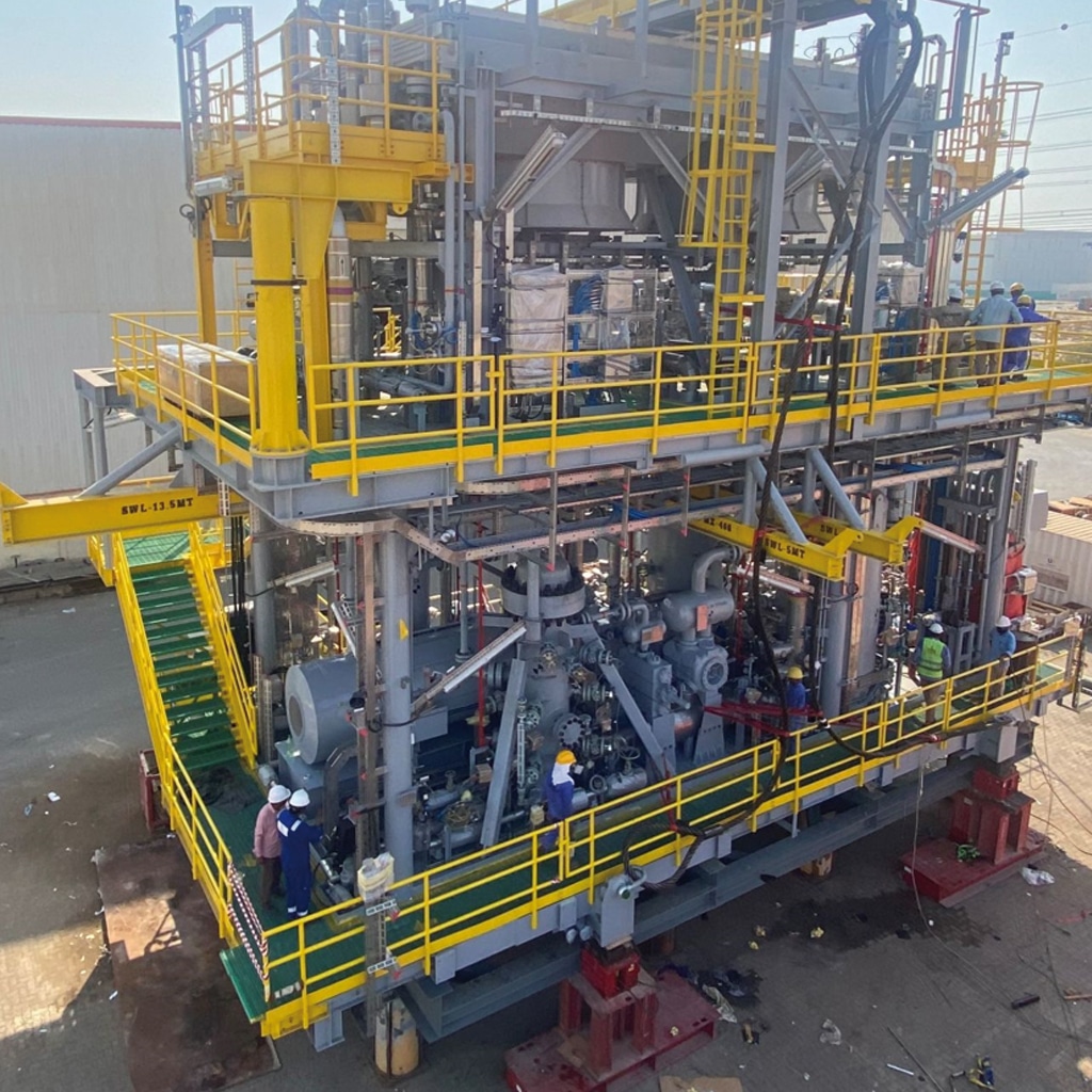 Workers at gas lift compression module of a floating, production, storage and offloading (FPSO) vessel in West Africa.